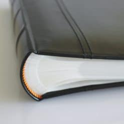 Close Up Of Spine Of Black Leather 200 Album Slip-In