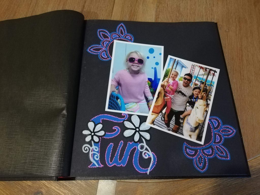 Coral Coast drymount album using Life of Colour paint pens to decorate the page around the photos